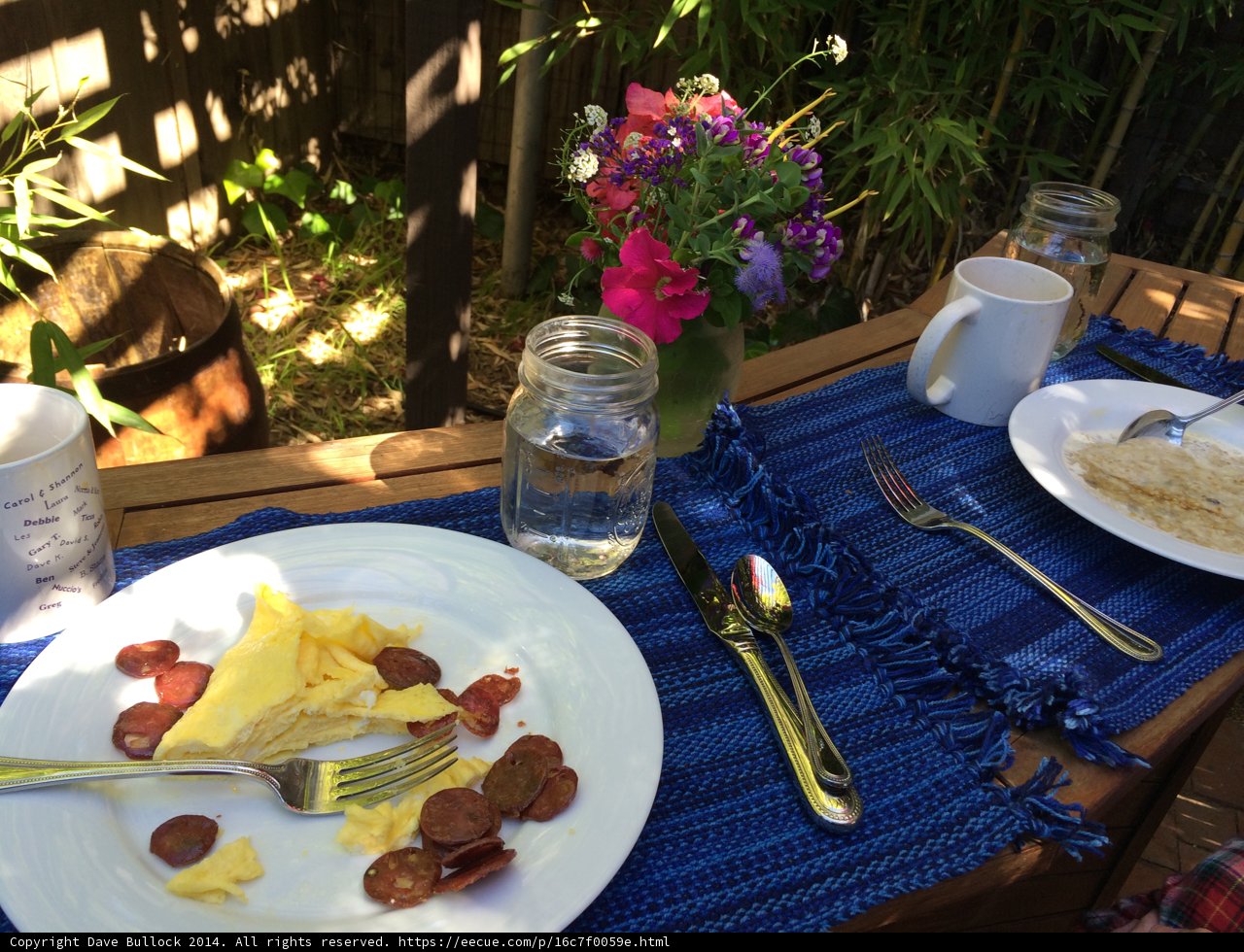 Blue Tablecloth and Flower Arrangement