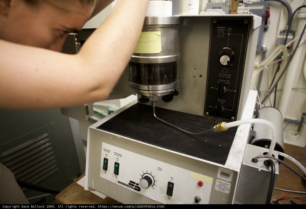 Woman Operating Electrical Device in Manufacturing Facility