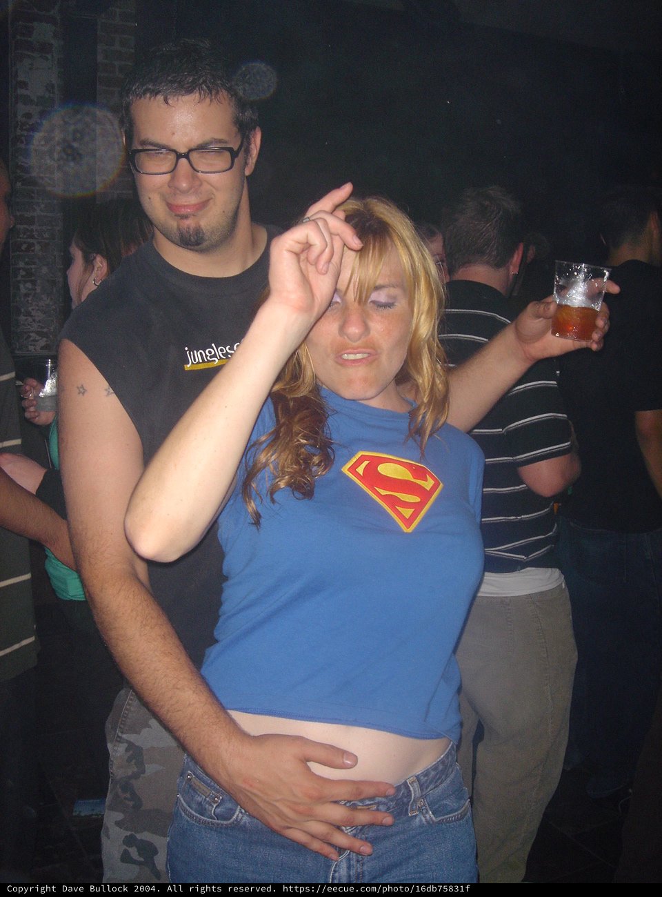 Couple Dancing at a Crowded Nightclub Party