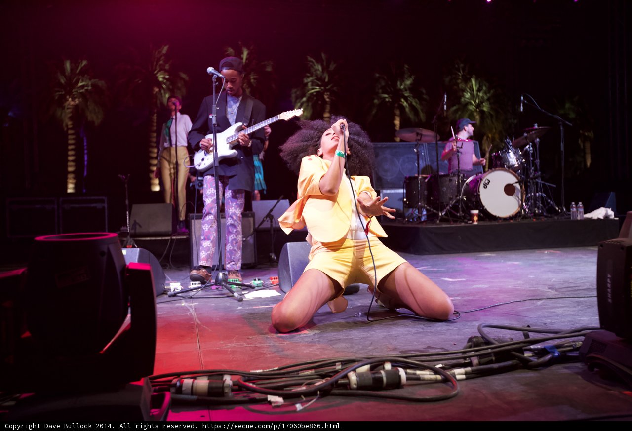 Yellow Lady Rocking the Stage with Her Guitar