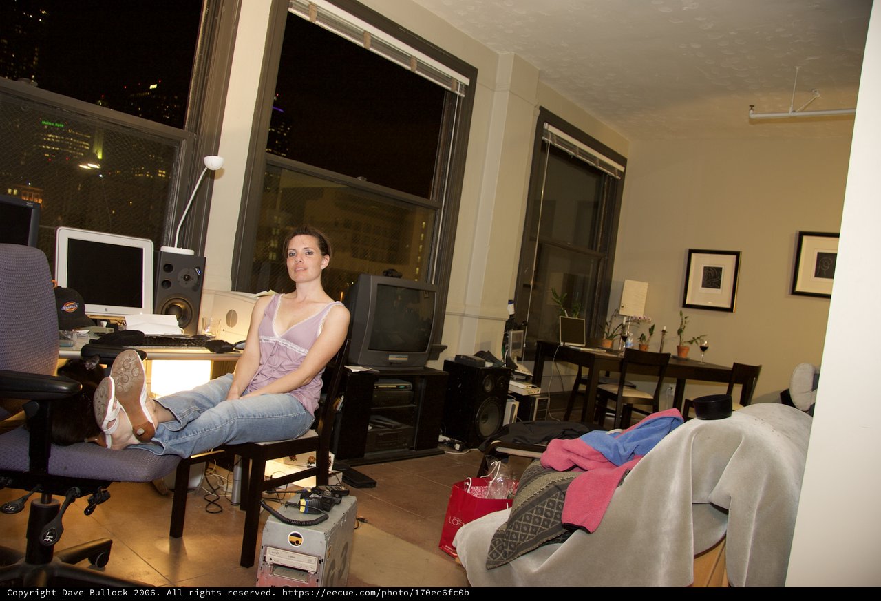Woman Relaxing in Urban Loft Office at Night
