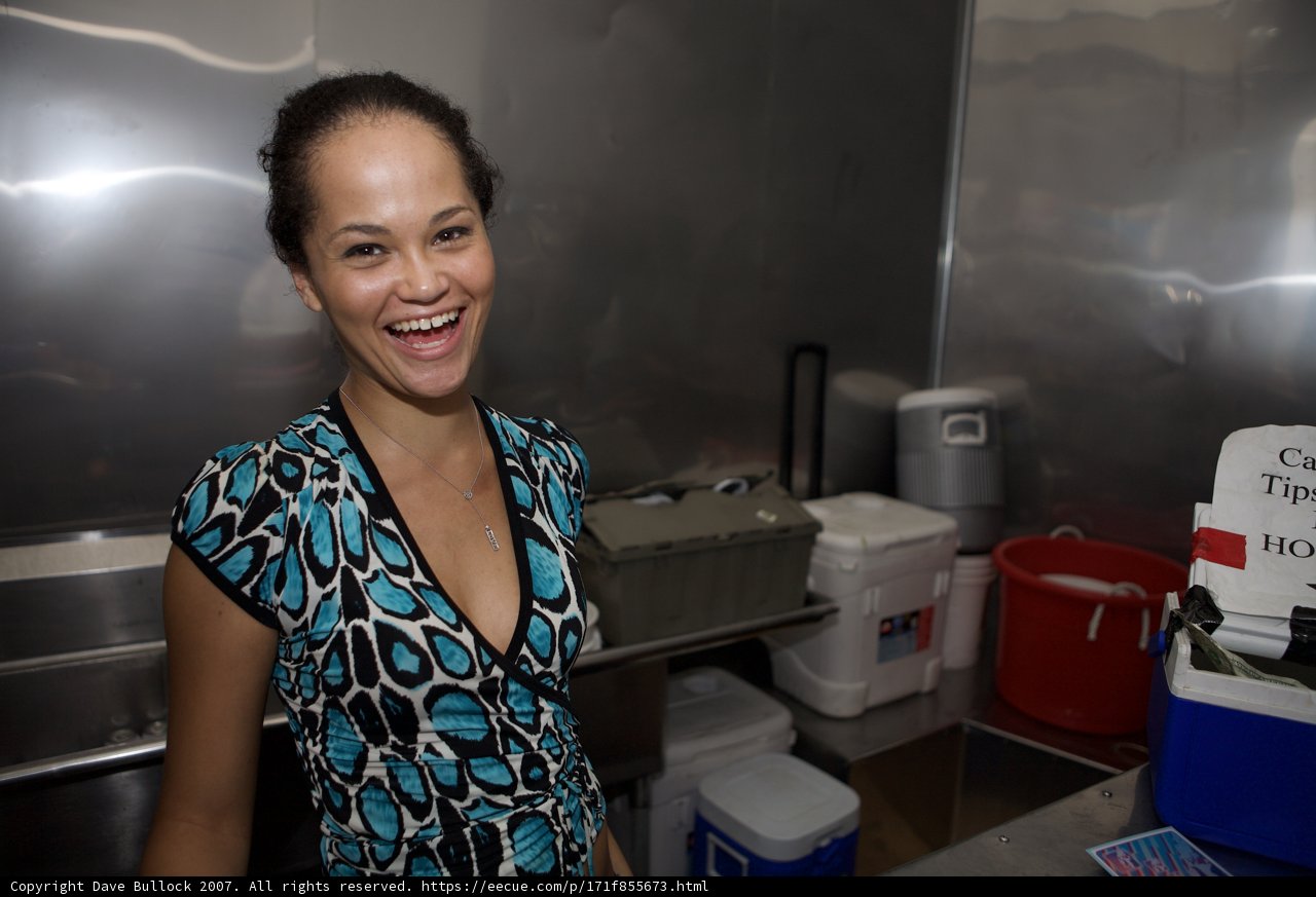 Happy Woman with Cooler in Kitchen
