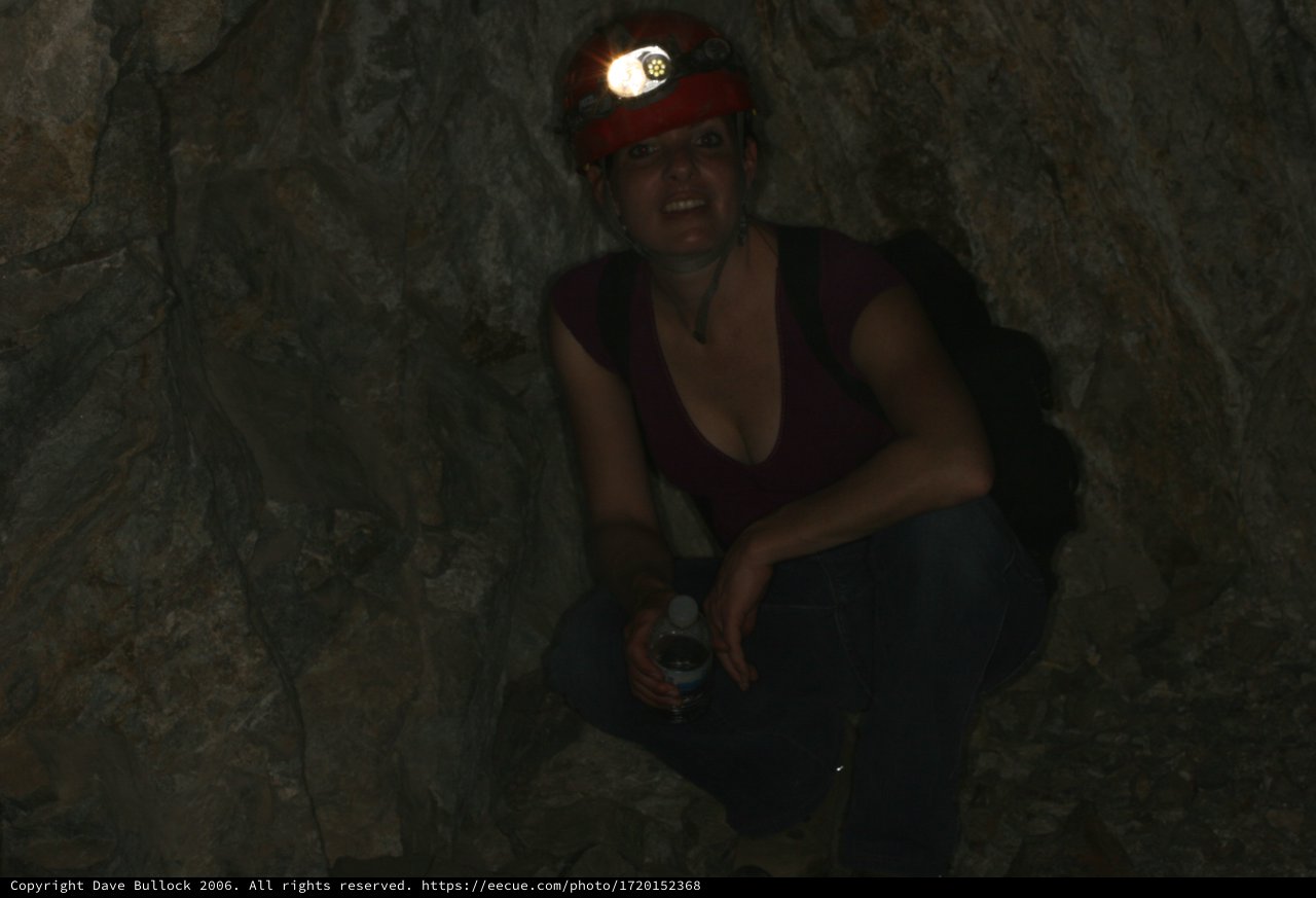 Adventurous Caver Smiling Deep Underground