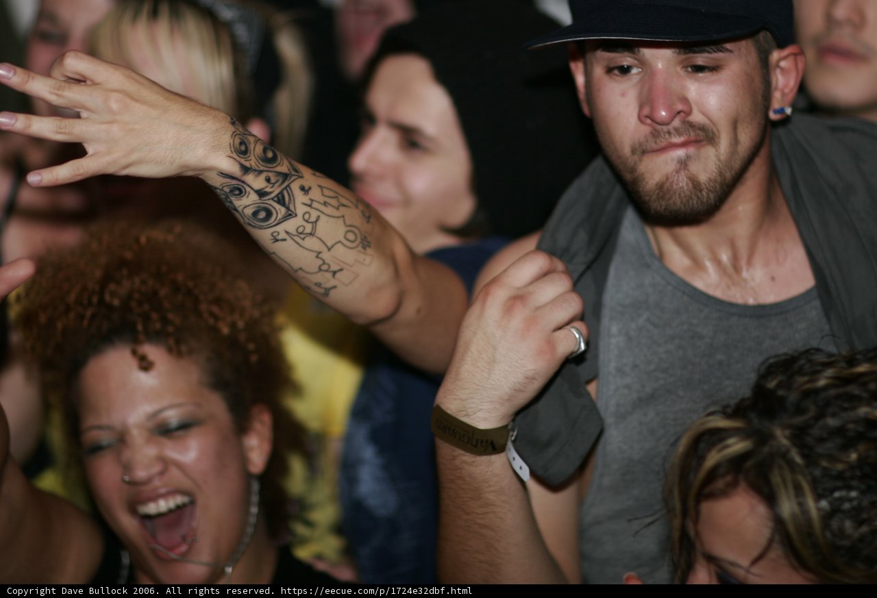 Gray Shirted Man Flaunts Tattoos