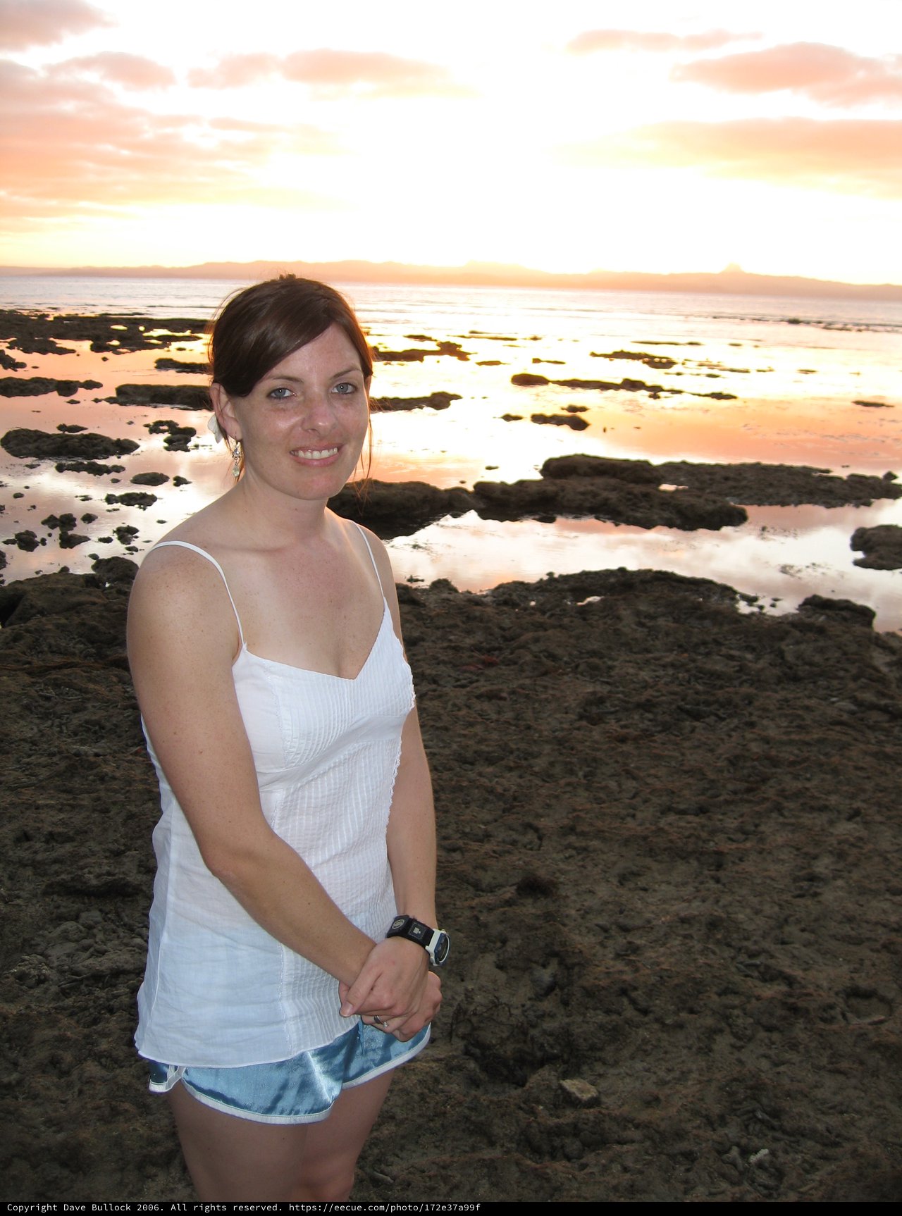 Woman Smiling at Stunning Fiji Coastal Sunset