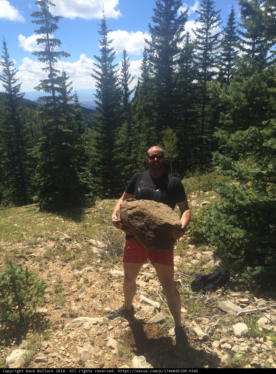 The Man and the Mighty Rock in the Woods