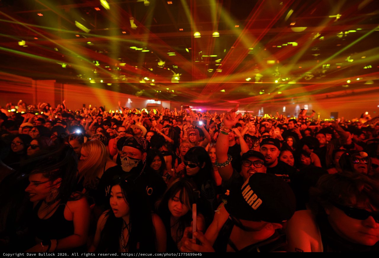 Massive Crowd Surges Under Laser Light Show
