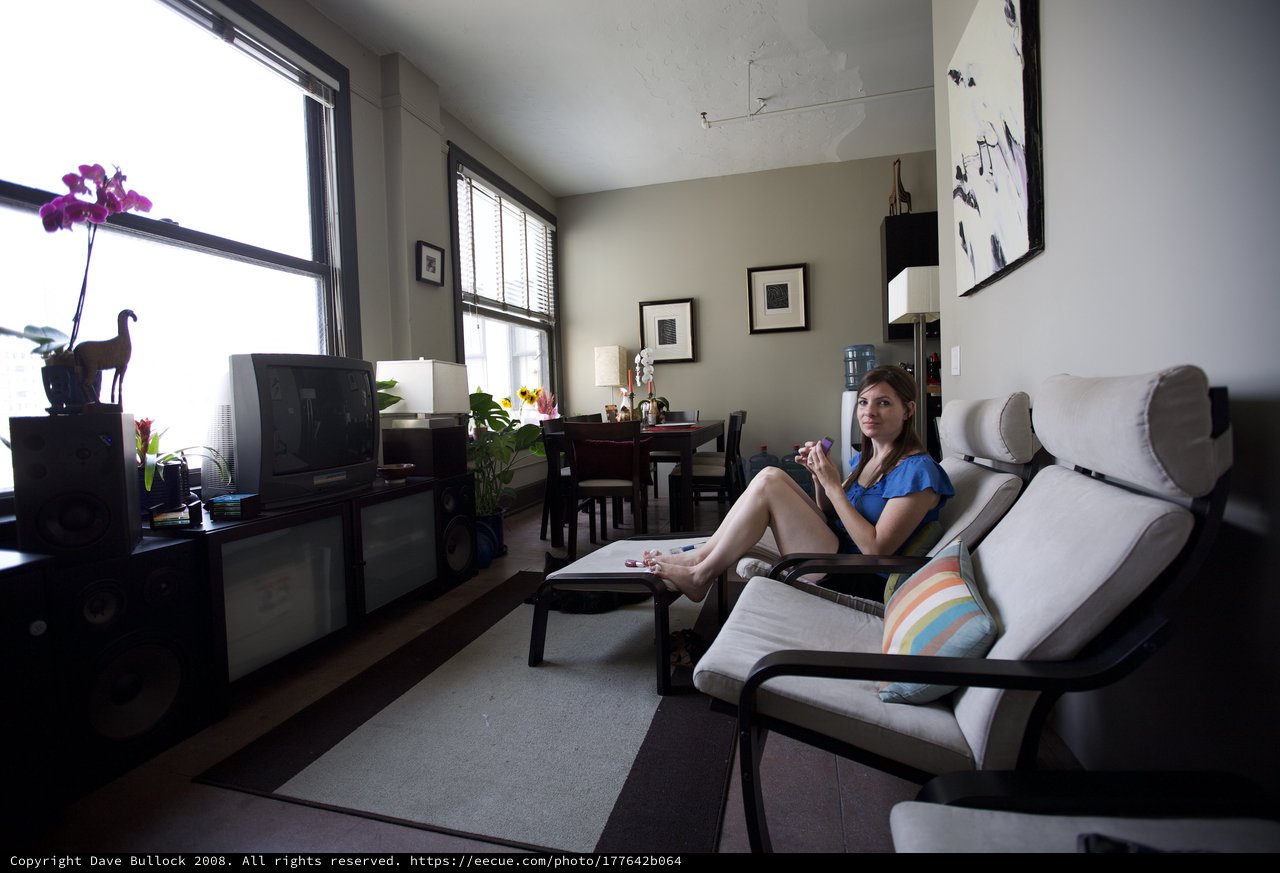 Woman Relaxing in Urban Apartment on Independence Day
