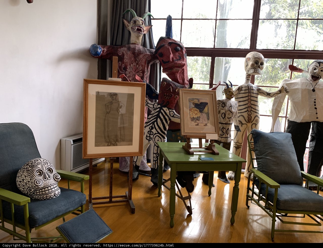 A Cozy Scene of Diverse Individuals in a Wood-Floor Living Room