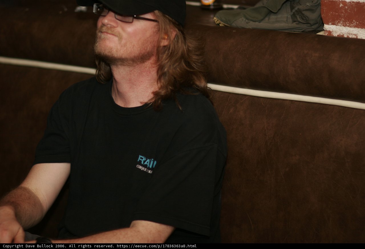 Black Shirted Man Relaxing on the Couch