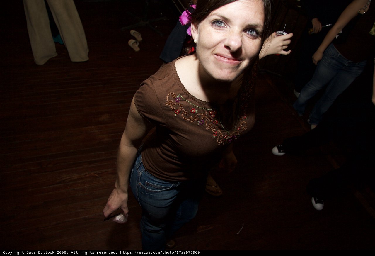 Woman Dancing Joyfully at Art Walk Party