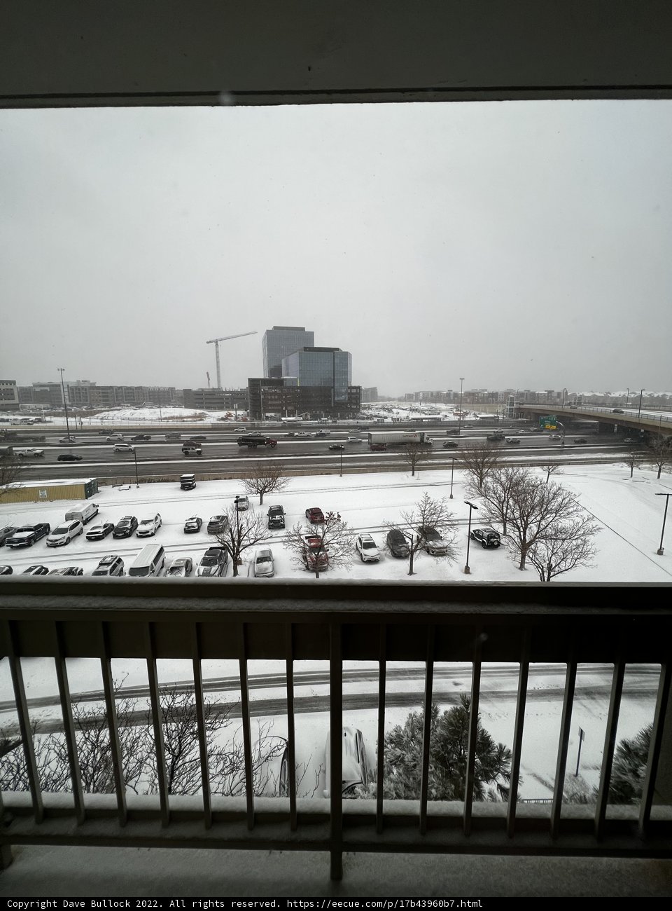 Snowy Cityscape from a Balcony