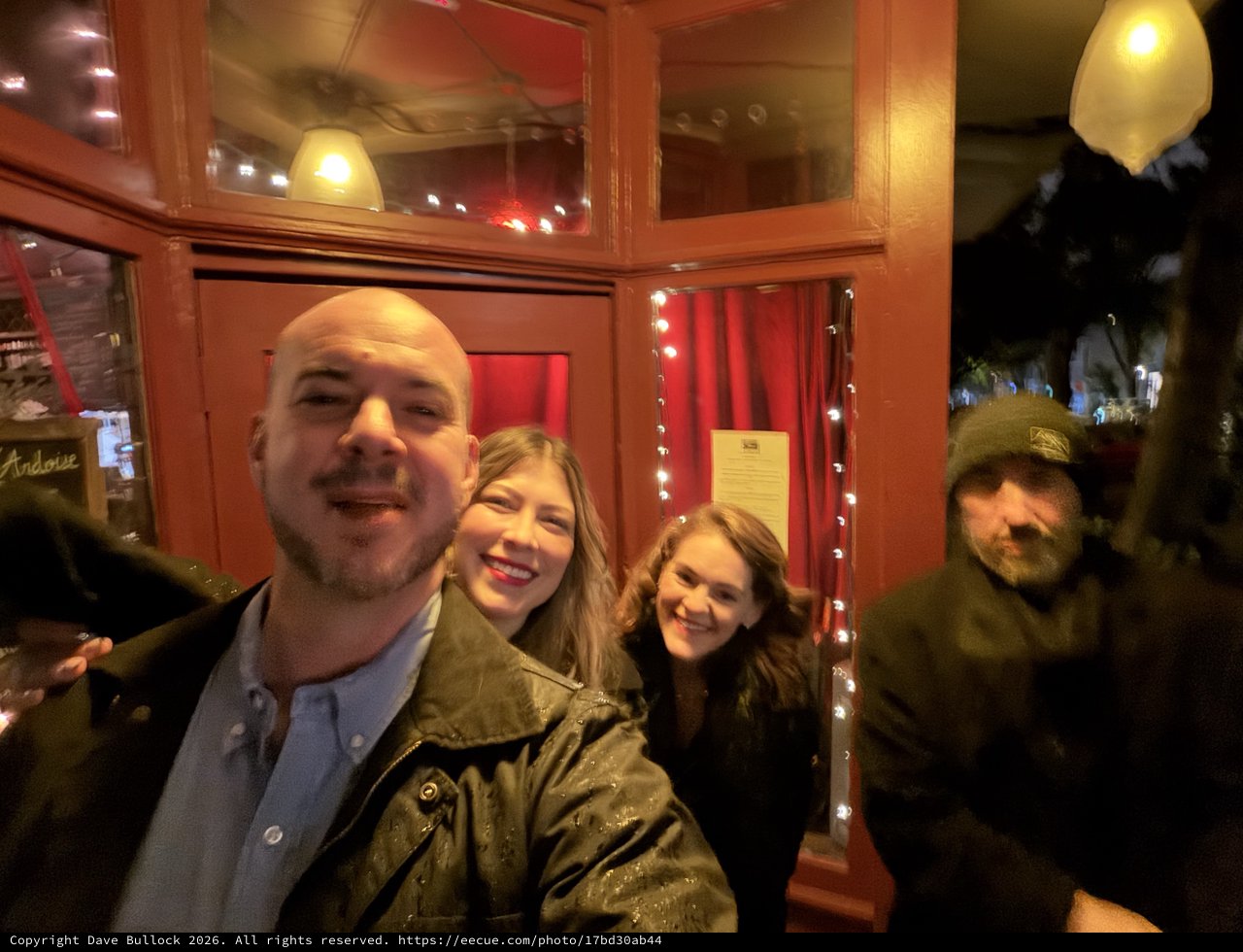 Friends Gathering at Cozy Restaurant Entrance