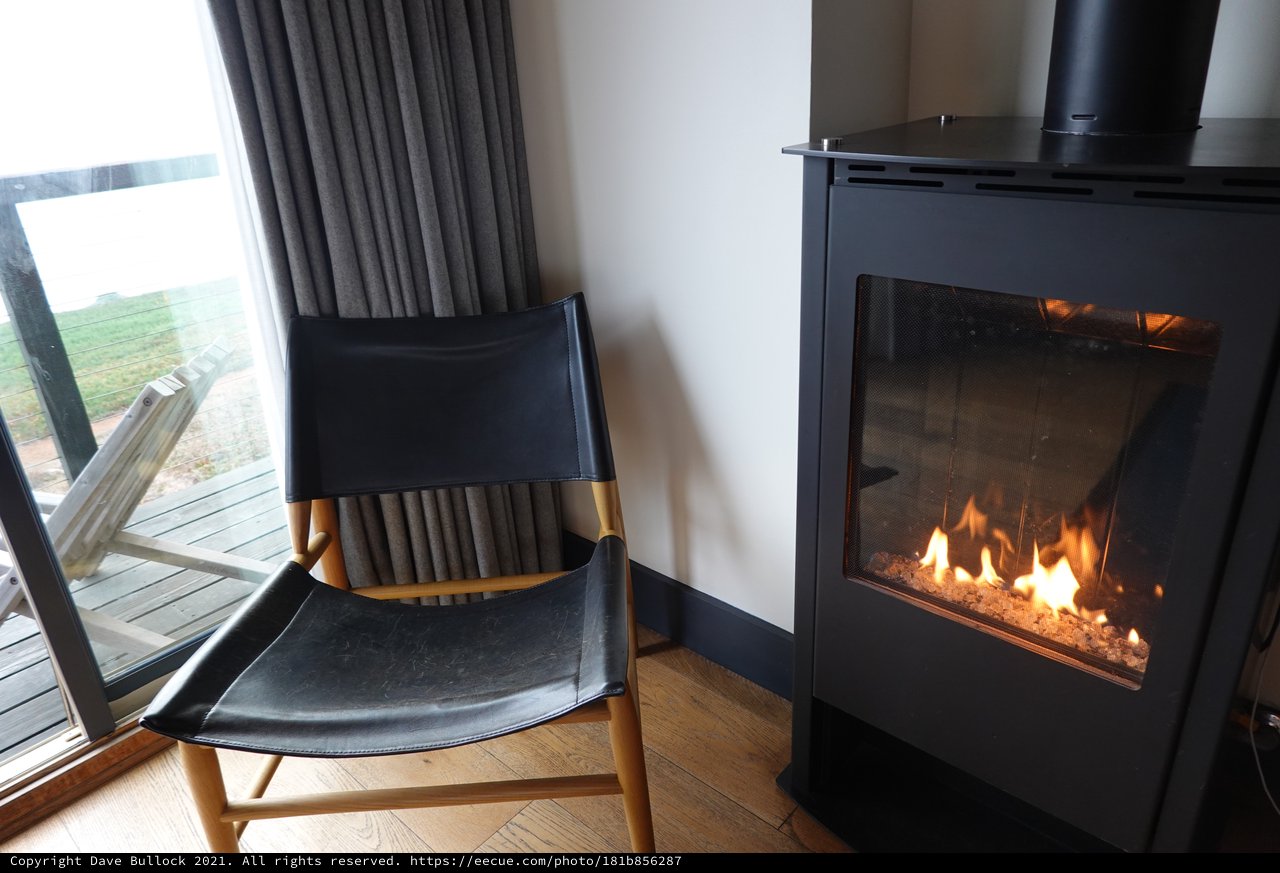 Cozy Fireside Reading Nook with Modern Stove