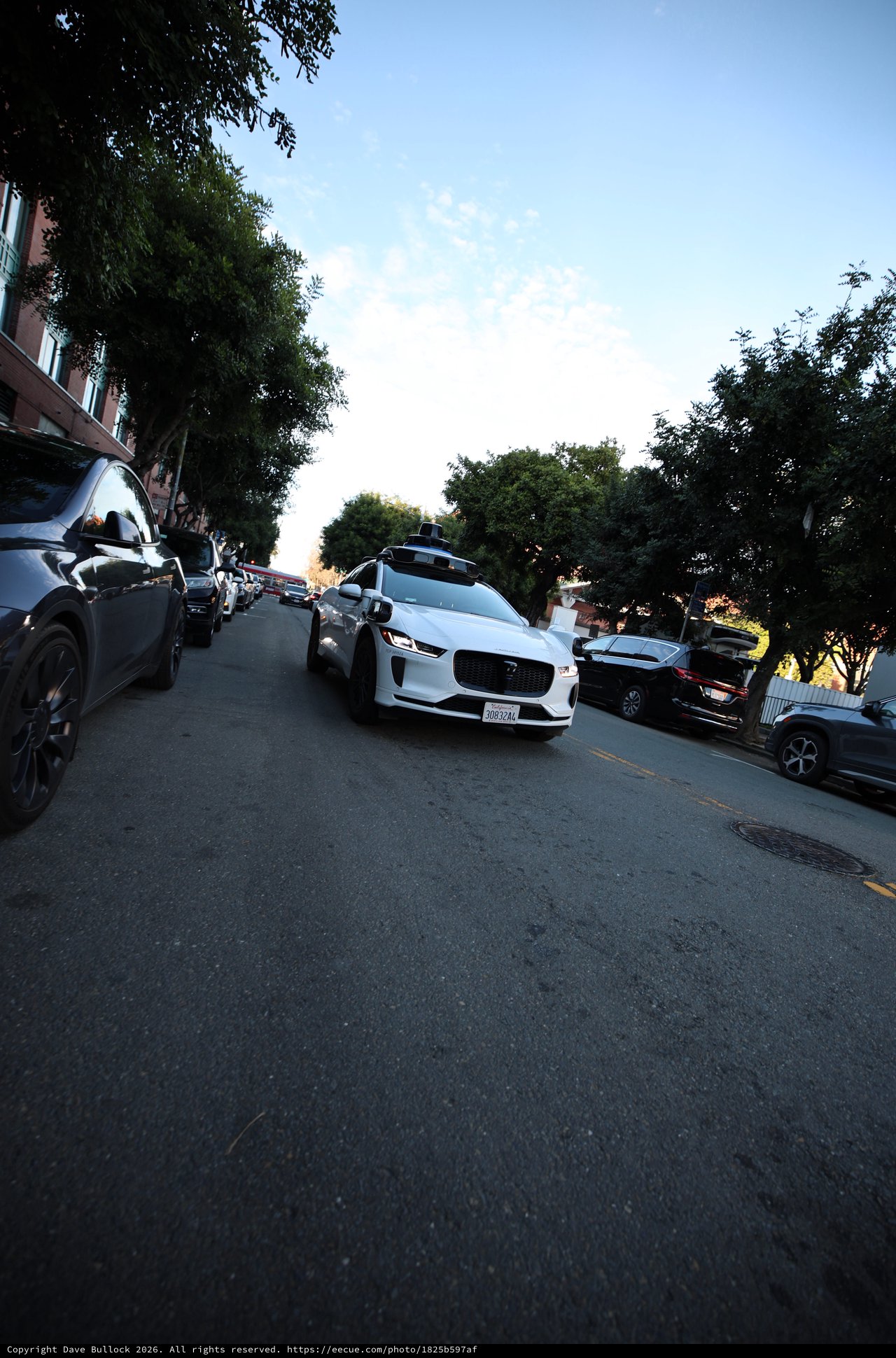 White Jaguar I-PACE on San Francisco Street at Dusk