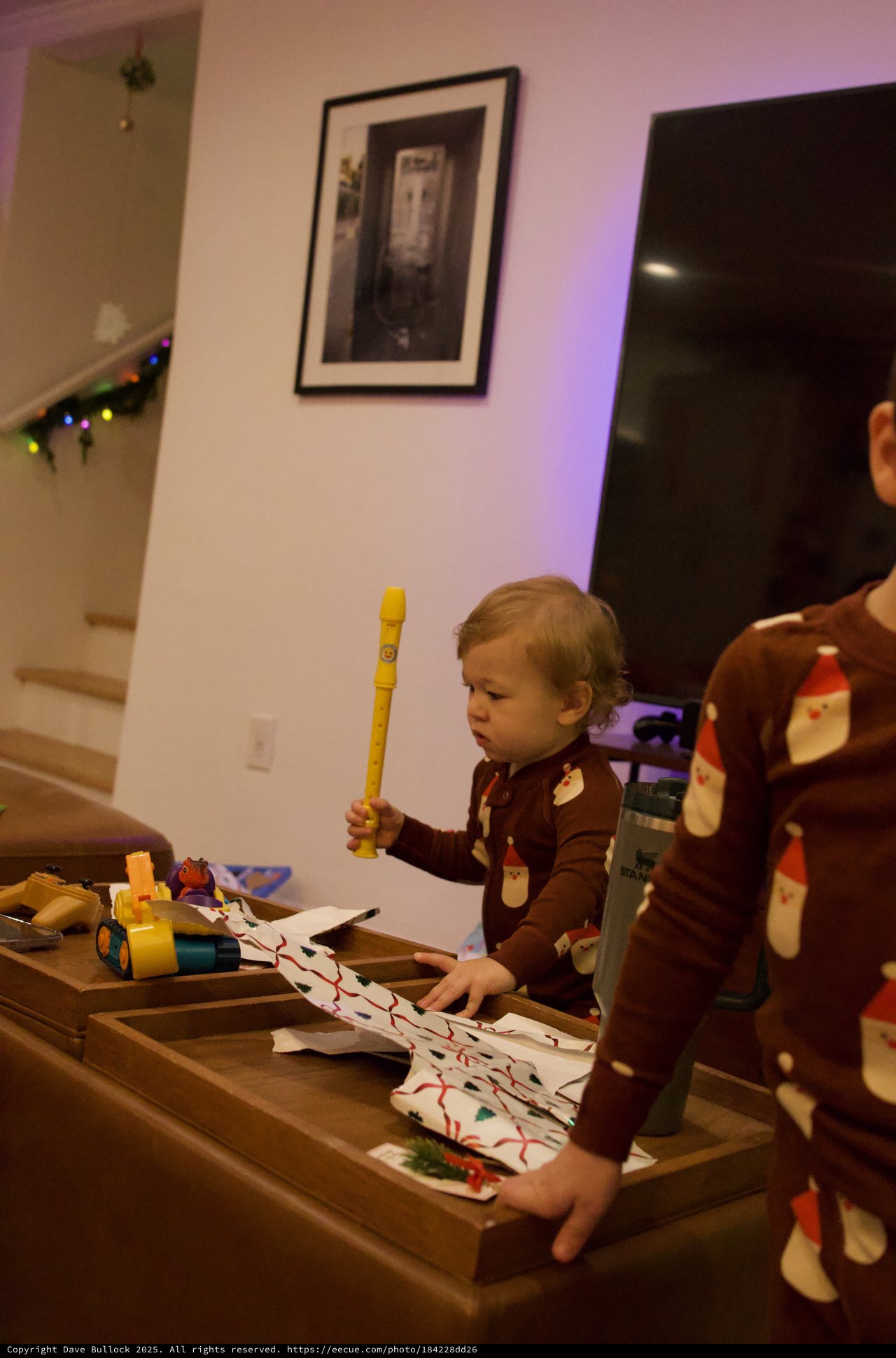 Toddler Playing Yellow Recorder at Christmas