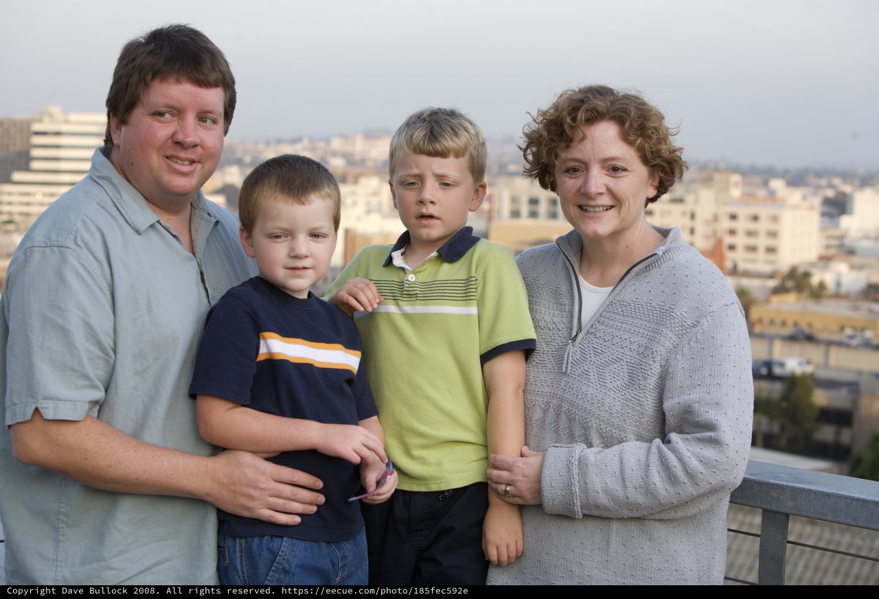 Family Portrait on Urban Rooftop at Dusk