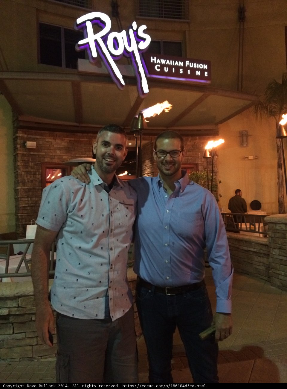 Two Men Enjoy a Night Out at the Local Restaurant