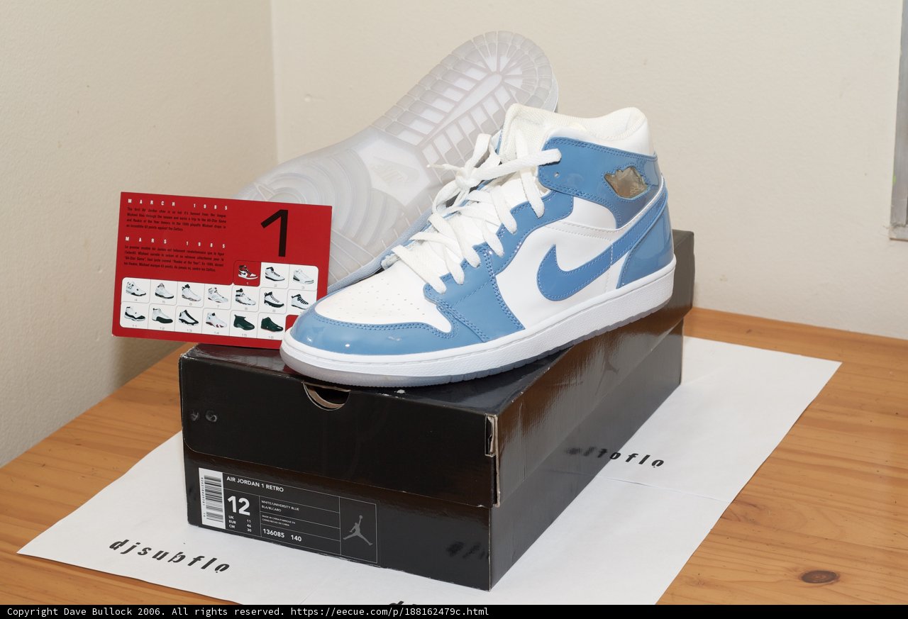 Blue and White Sneakers on Table