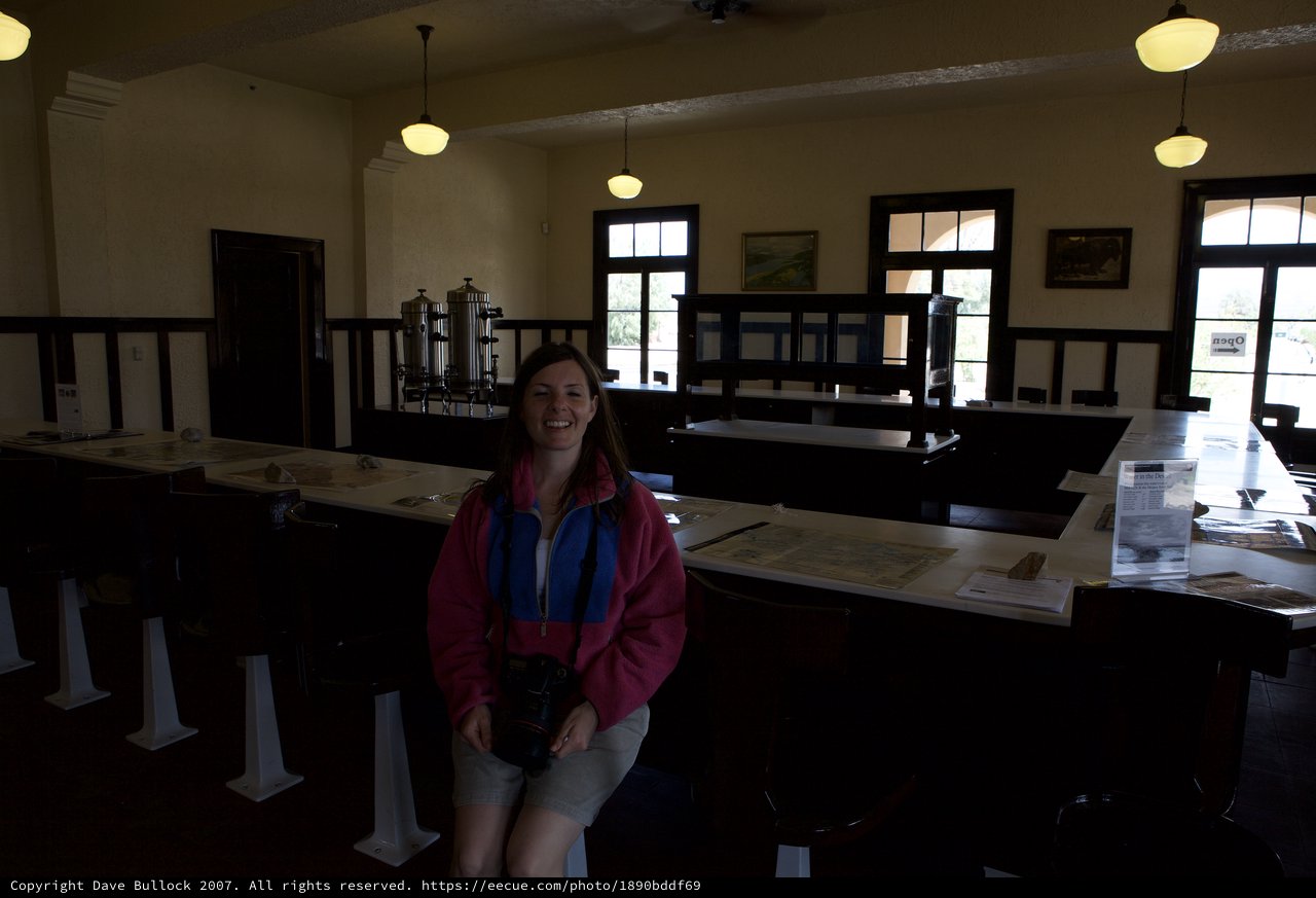 Smiling Visitor Inside a Desert Park Visitor Center