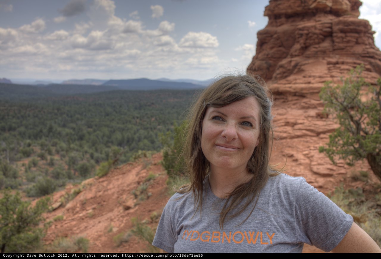 Woman Smiling Atop Sedona Red Rock Formation