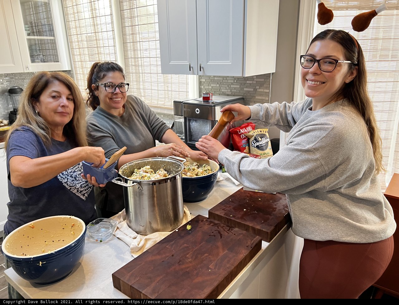 Three Women Preparing a Delicious Meal in the Kitchen