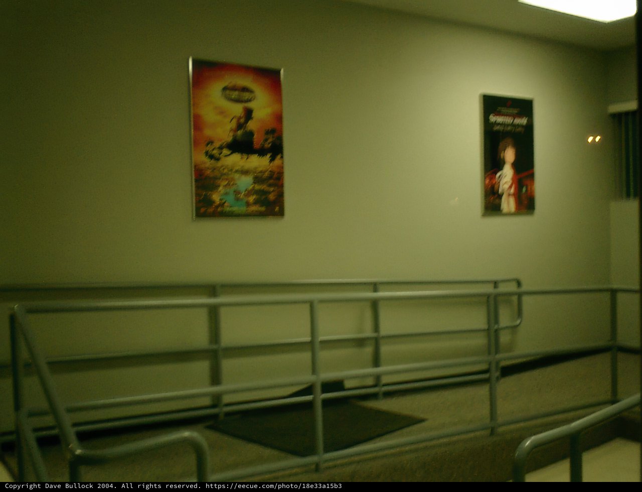 Aesthetic Hallway with a Minimalistic Railing and Posters