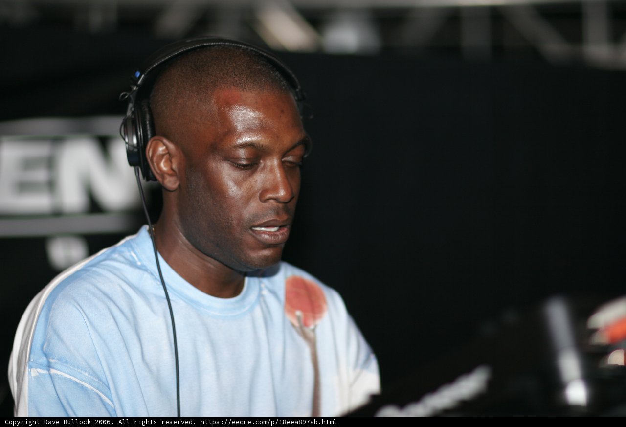 Blue-Clad Kenny Ken Spinning the Beats