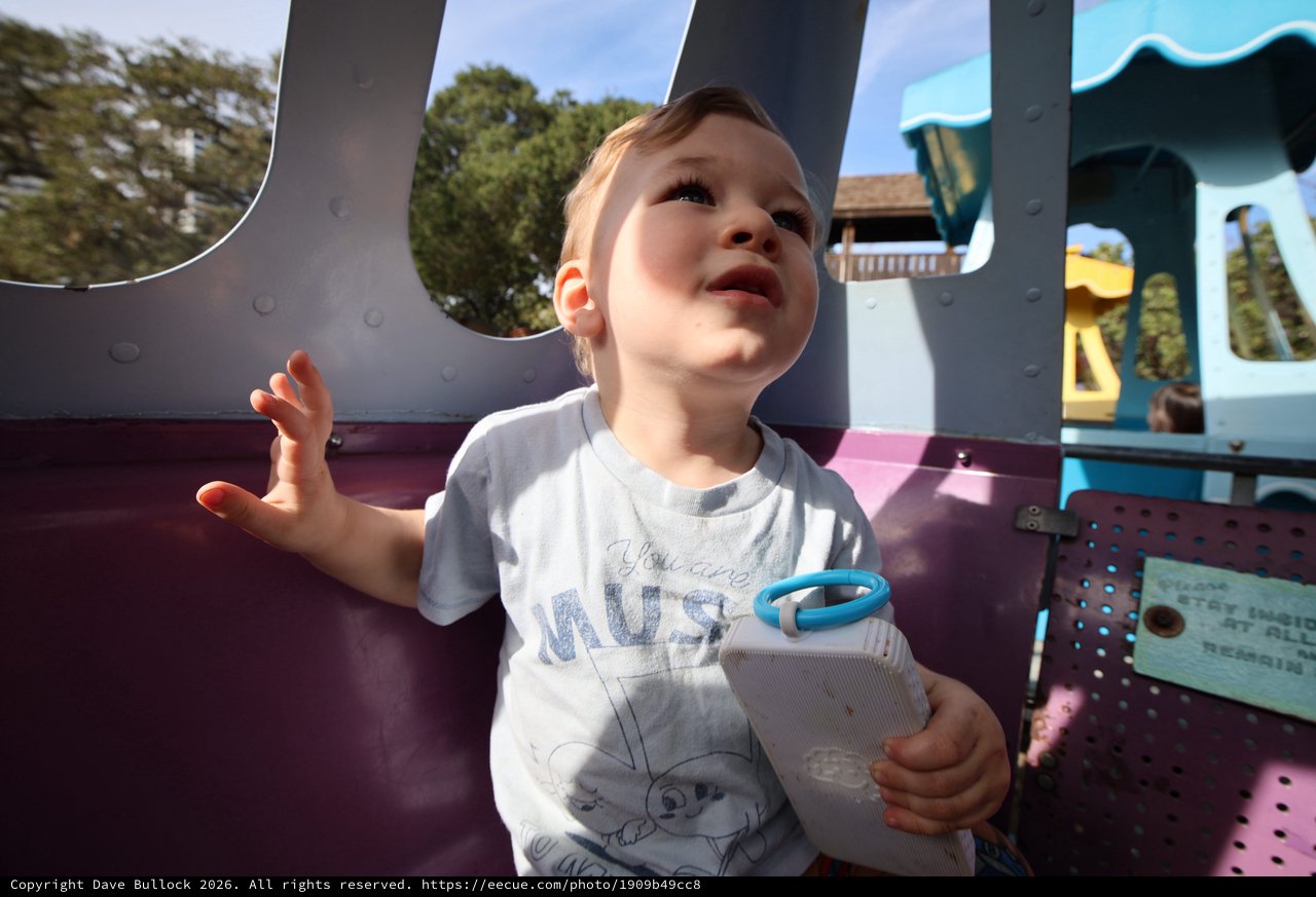 Joyful Toddler Playing at Colorful Playground