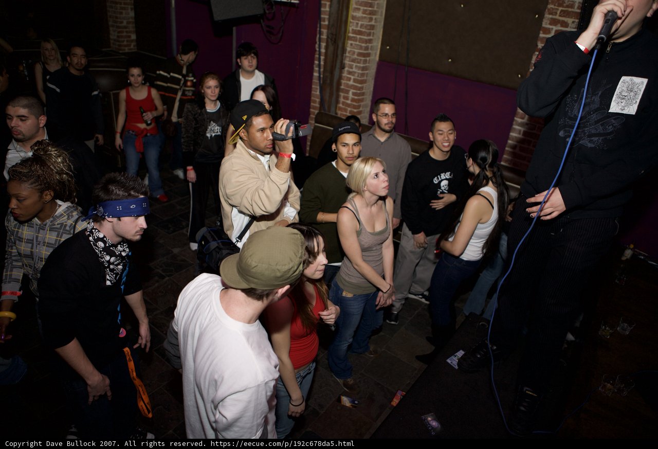 Urban Music Performer Captivates Crowd at Night Club