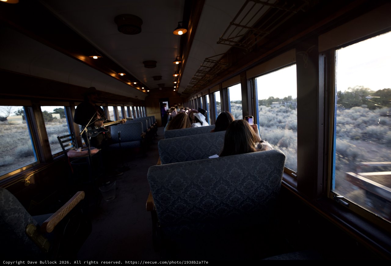 Scenic Train Journey Through Desert Landscape at Dusk