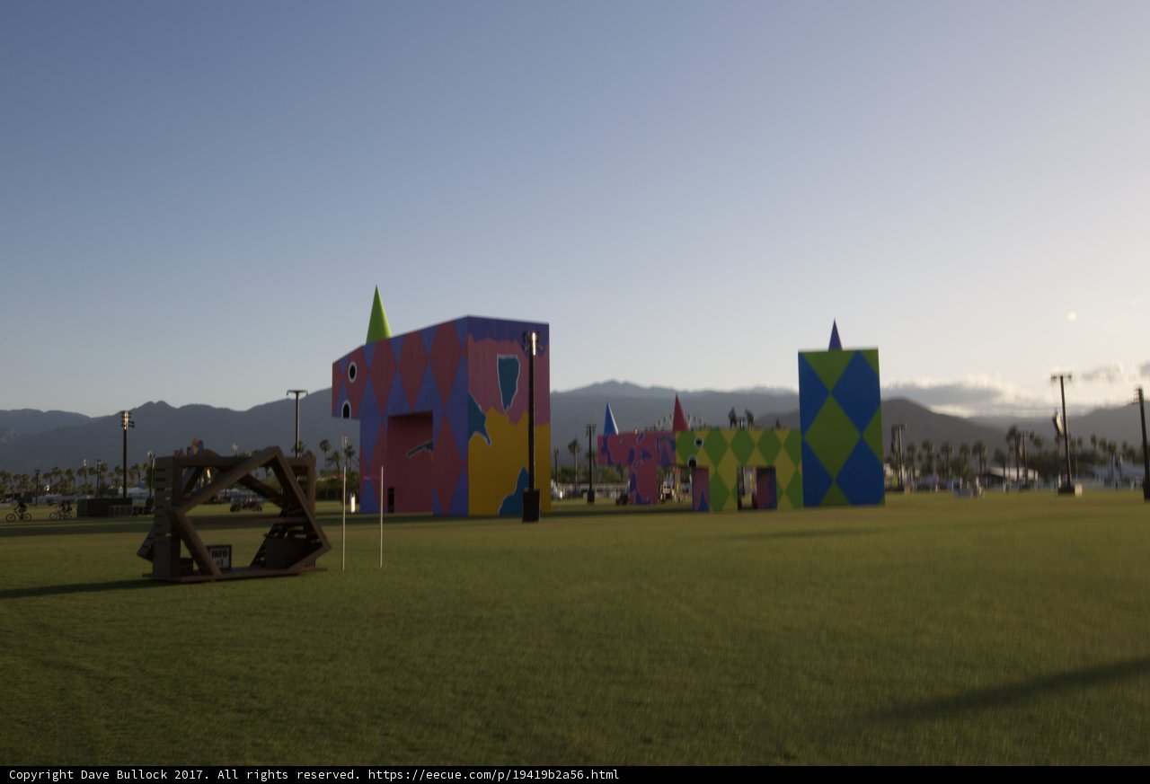 Colorful Buildings in a Grassy Mountain Landscape