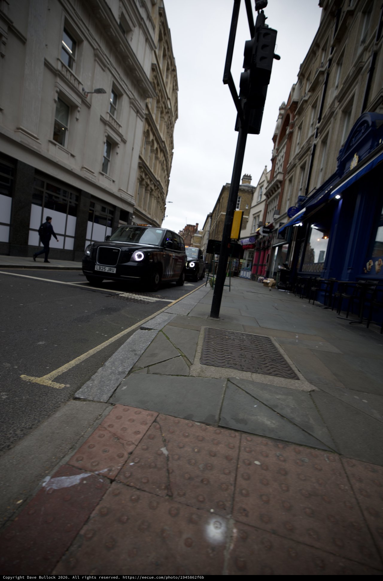 Low Angle Street View of London with Black Cab