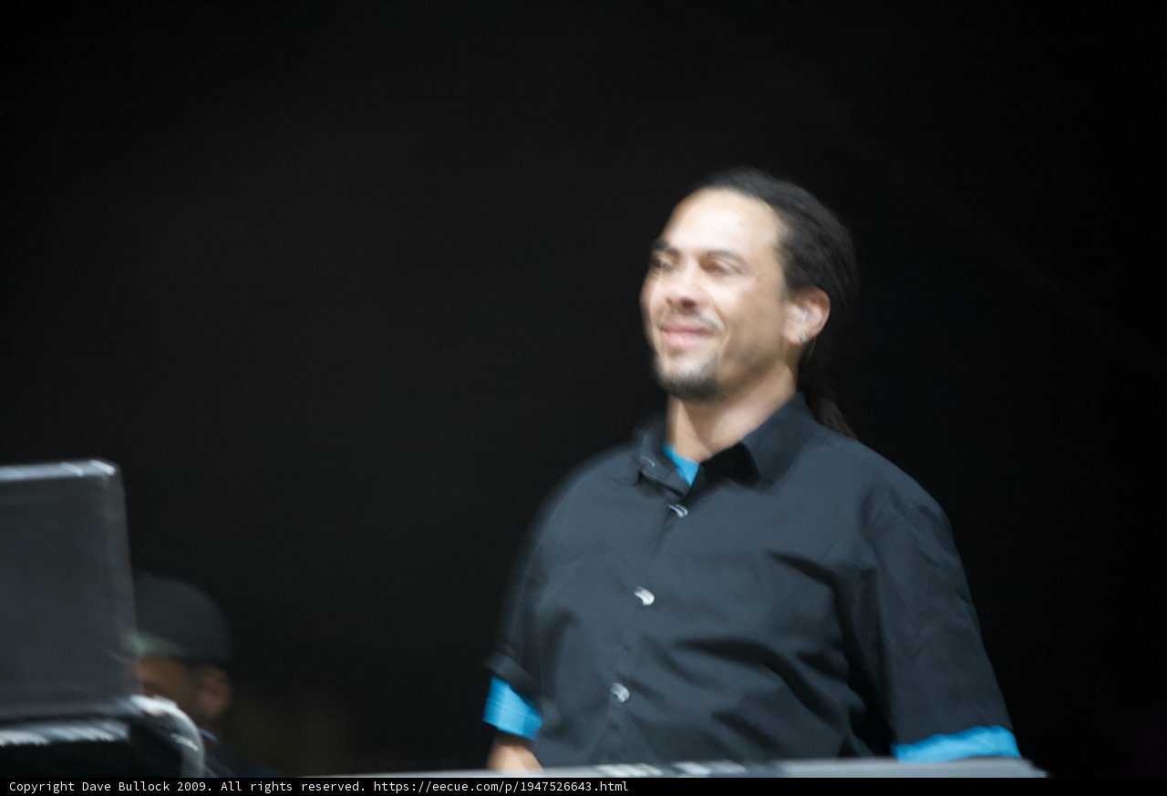 Roni Size Smiling for the Camera in Black Shirt