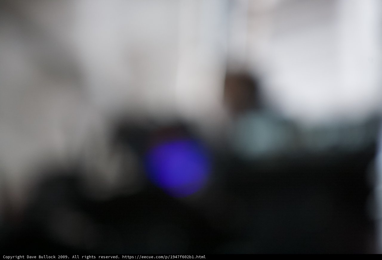Blurred Figure in Moody Lighting