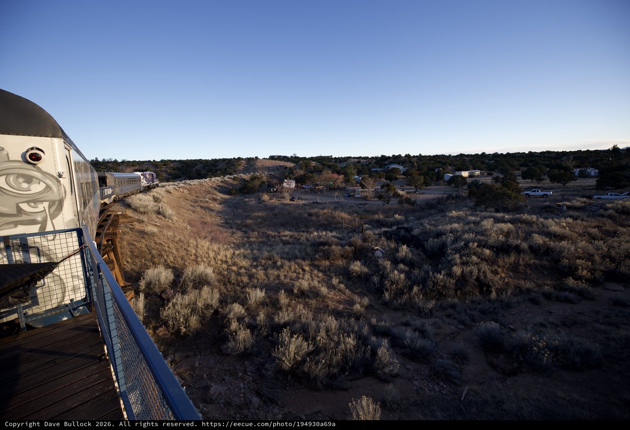 Vintage Train Car Observation Deck Over Desert Landscape