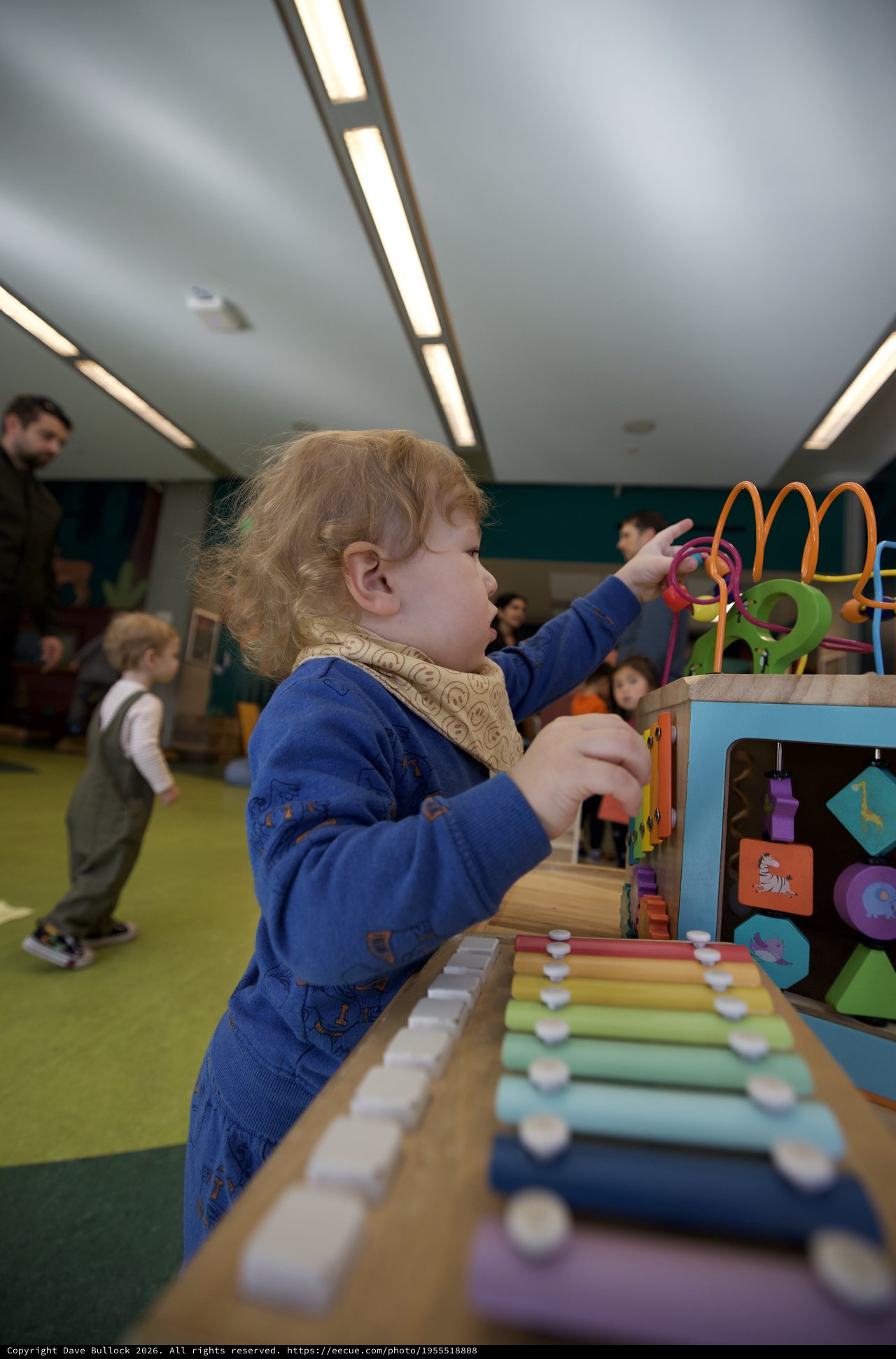 Toddler Engaged in Developmental Play at Activity Center
