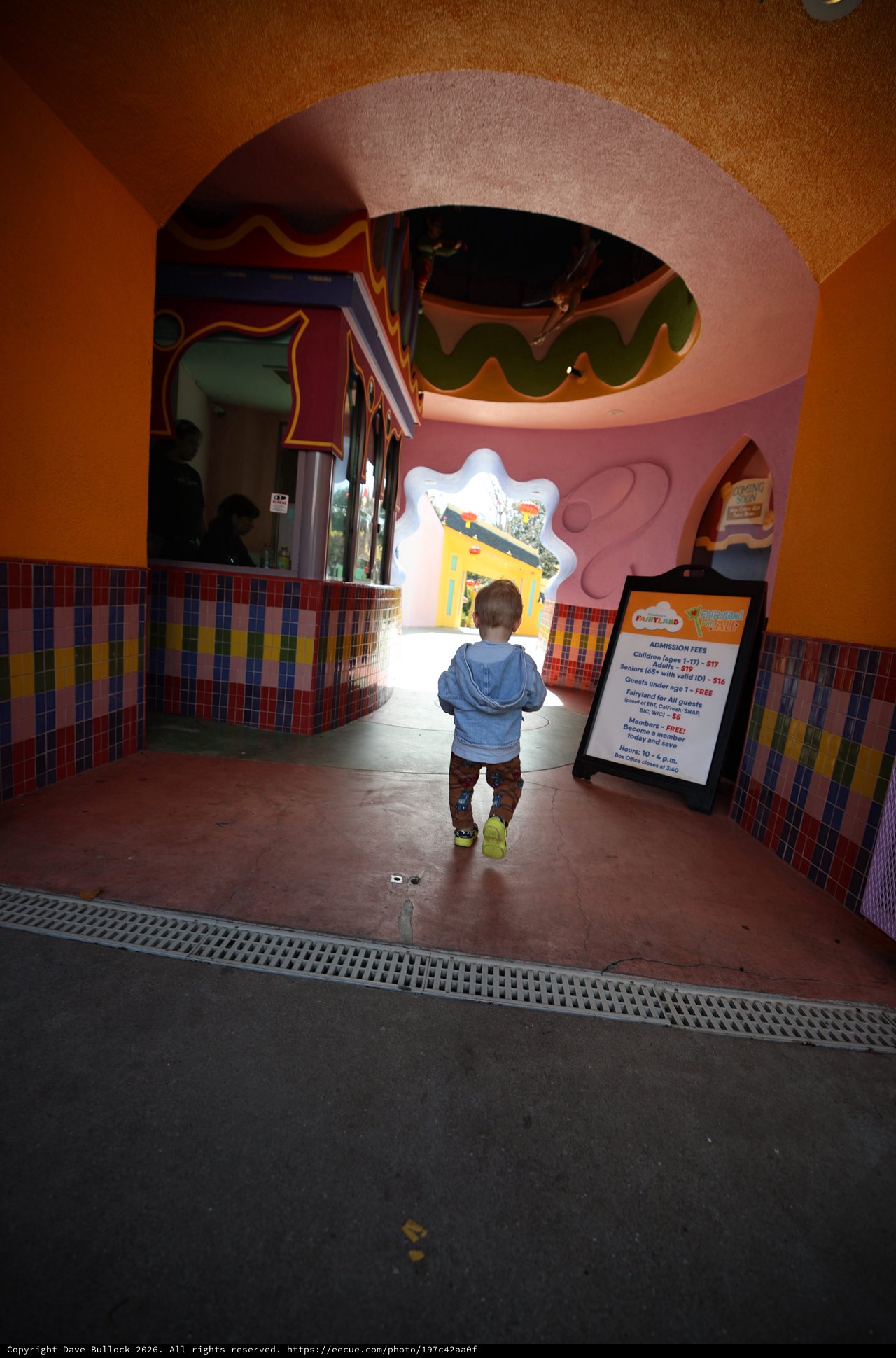 Toddler Exploring Whimsical Children's Play Area Entrance