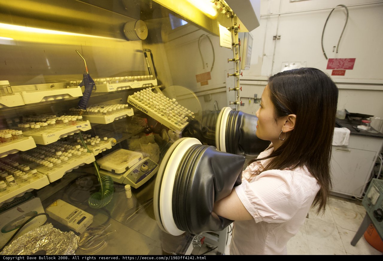 Woman in Lab with Glass Case