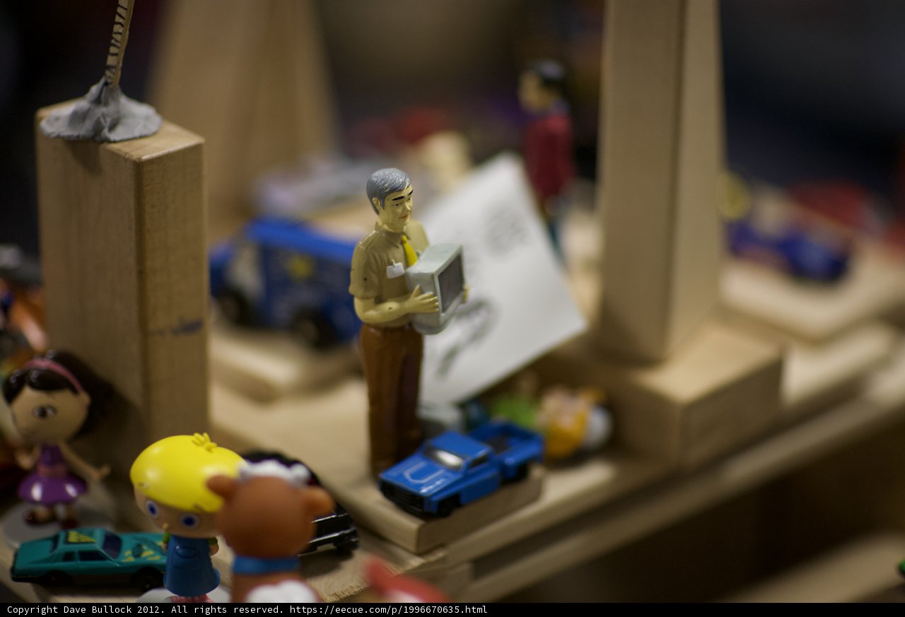 Toy Man on Wooden Platform