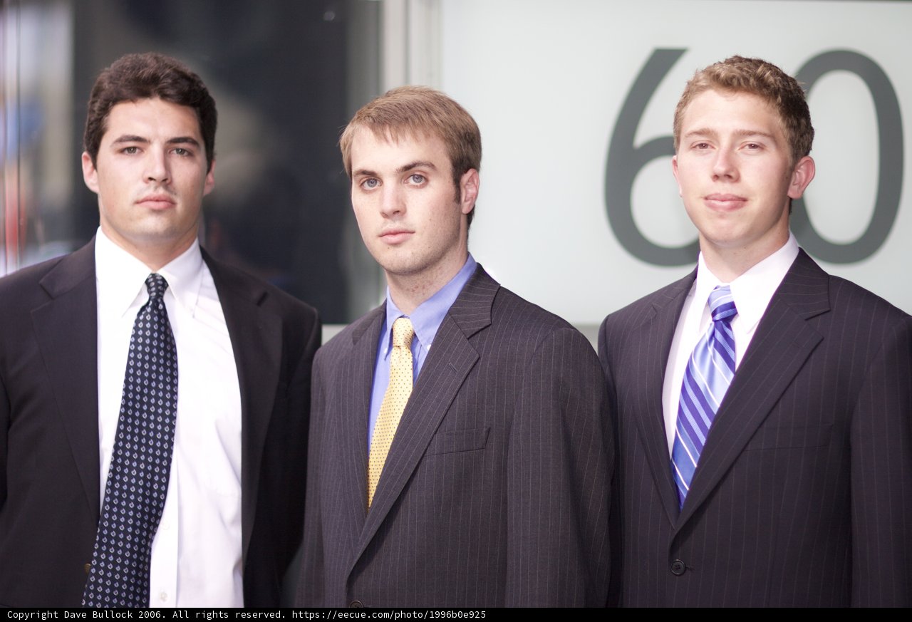 Three Men in Suits Ready for Business