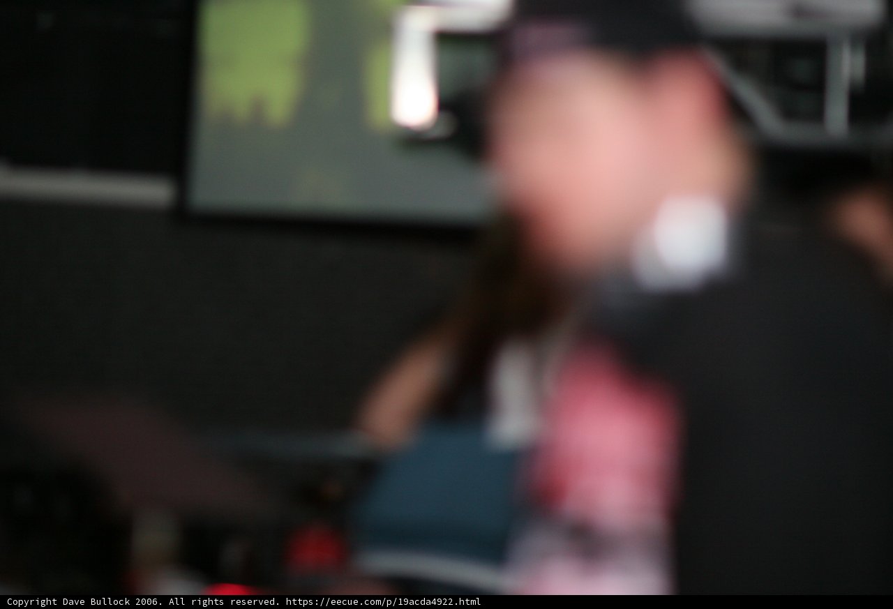 Shadowy Figure in a Dimly Lit Room