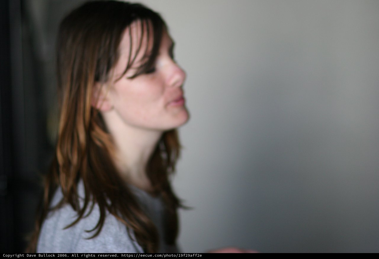 Pensive Profile of a Young Woman in Soft Light