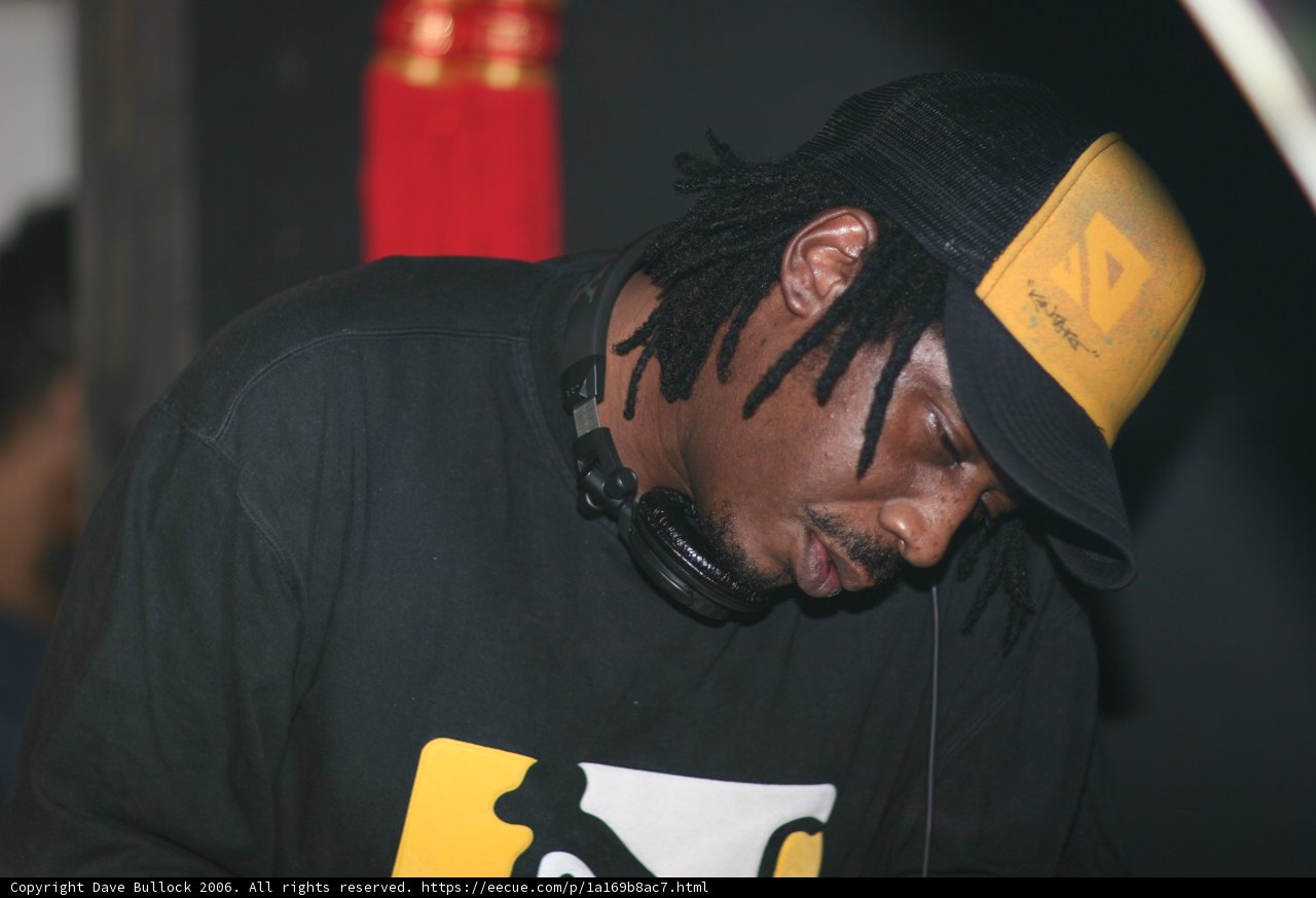 Black Shirted Performer in Baseball Cap