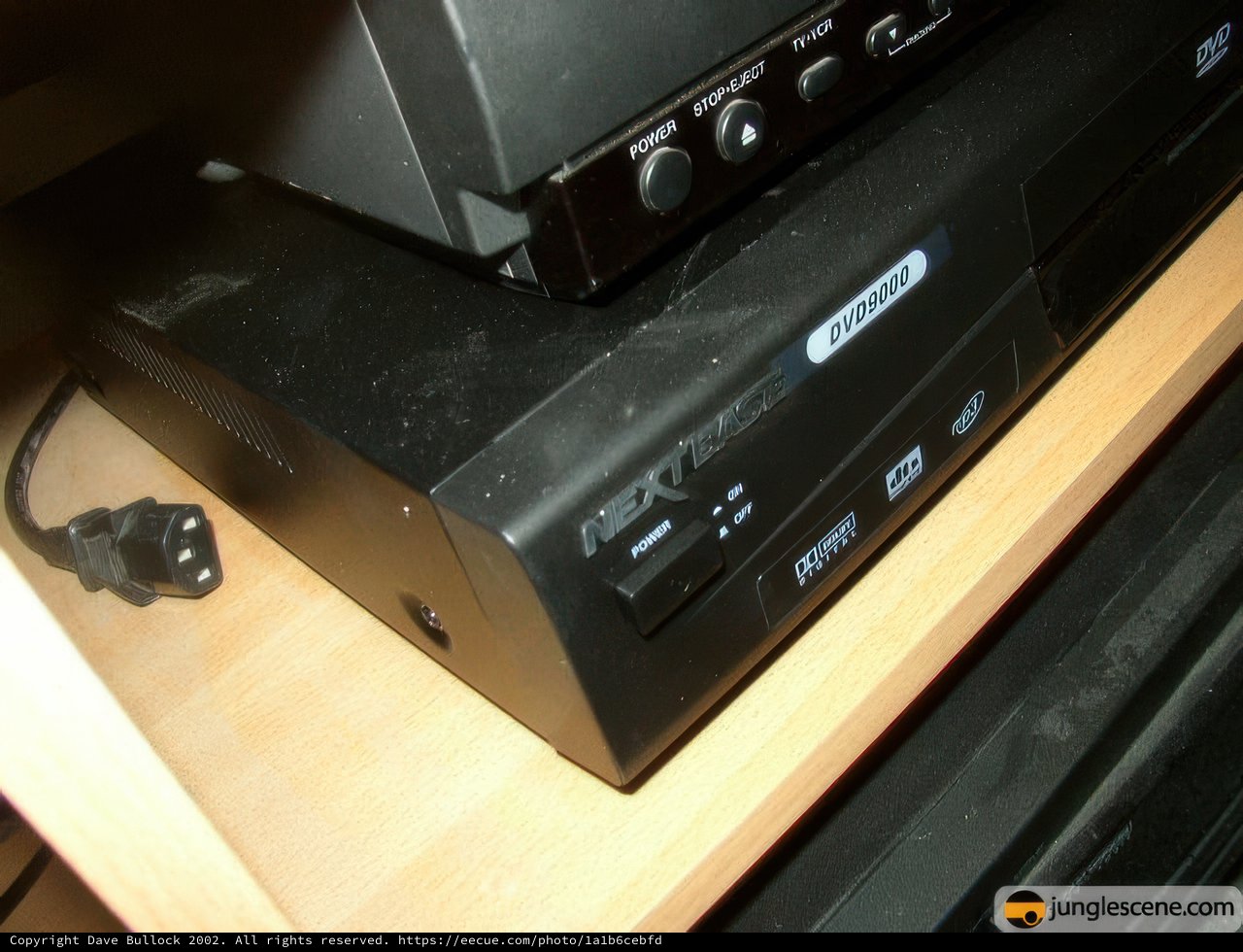 DVD Player and Remote Control on Shelf