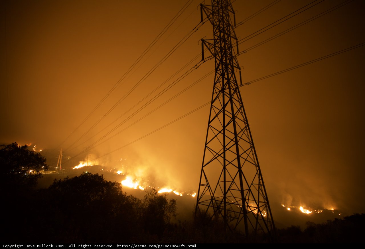 Flames Engulf Power Lines During Wildfire
