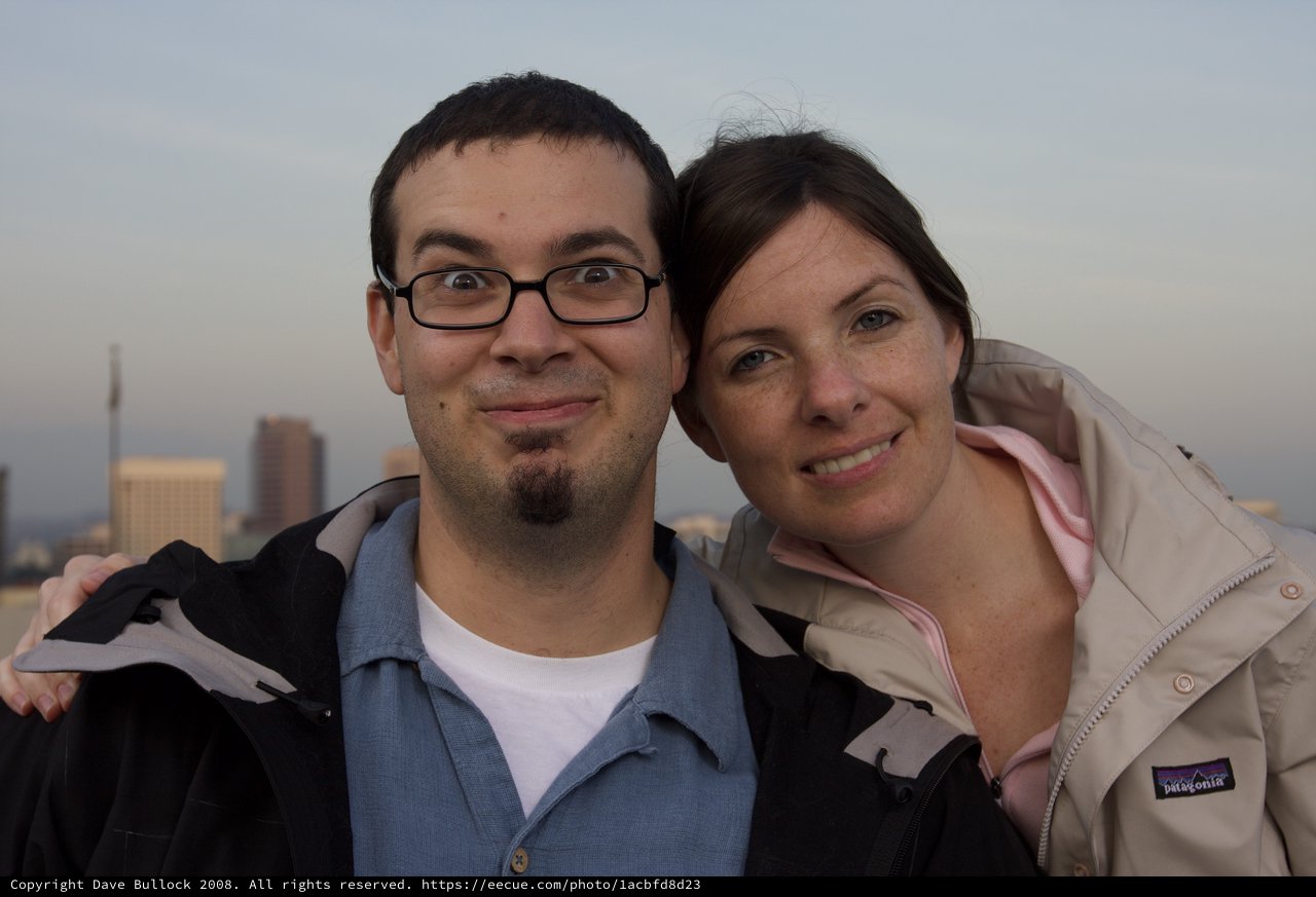 Couple Smiling Together Against City Skyline