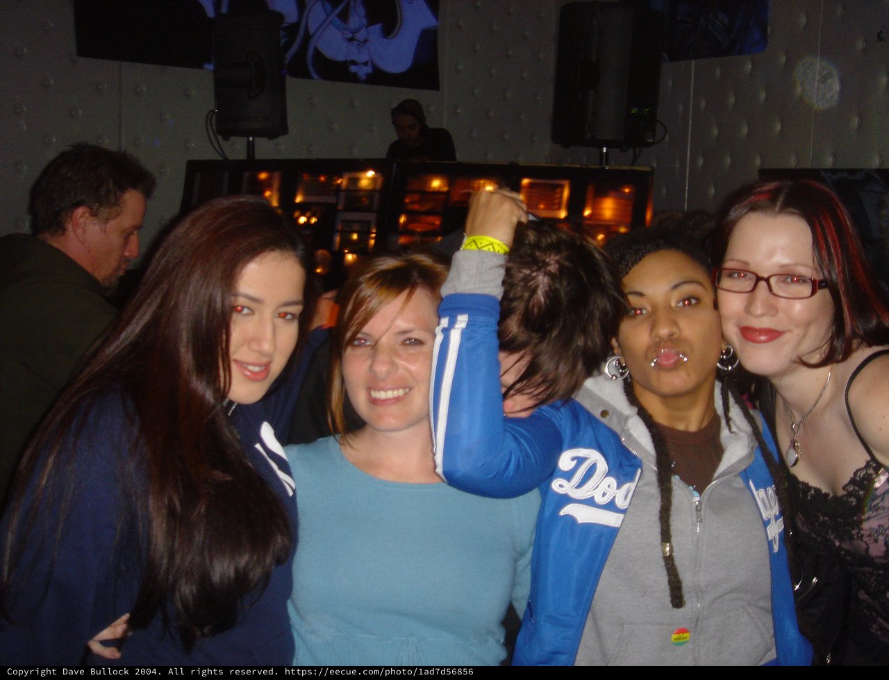 Four Friends Celebrating at a Nightclub in 2004