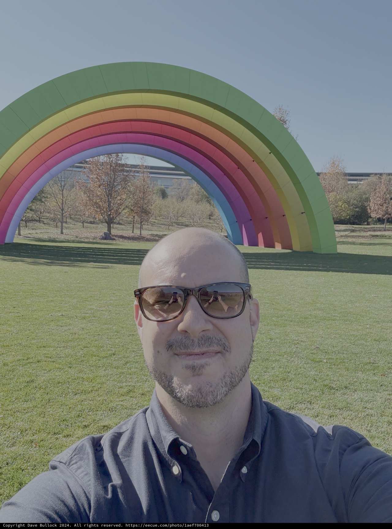 Man Takes Selfie at Colorful Rainbow Art Installation