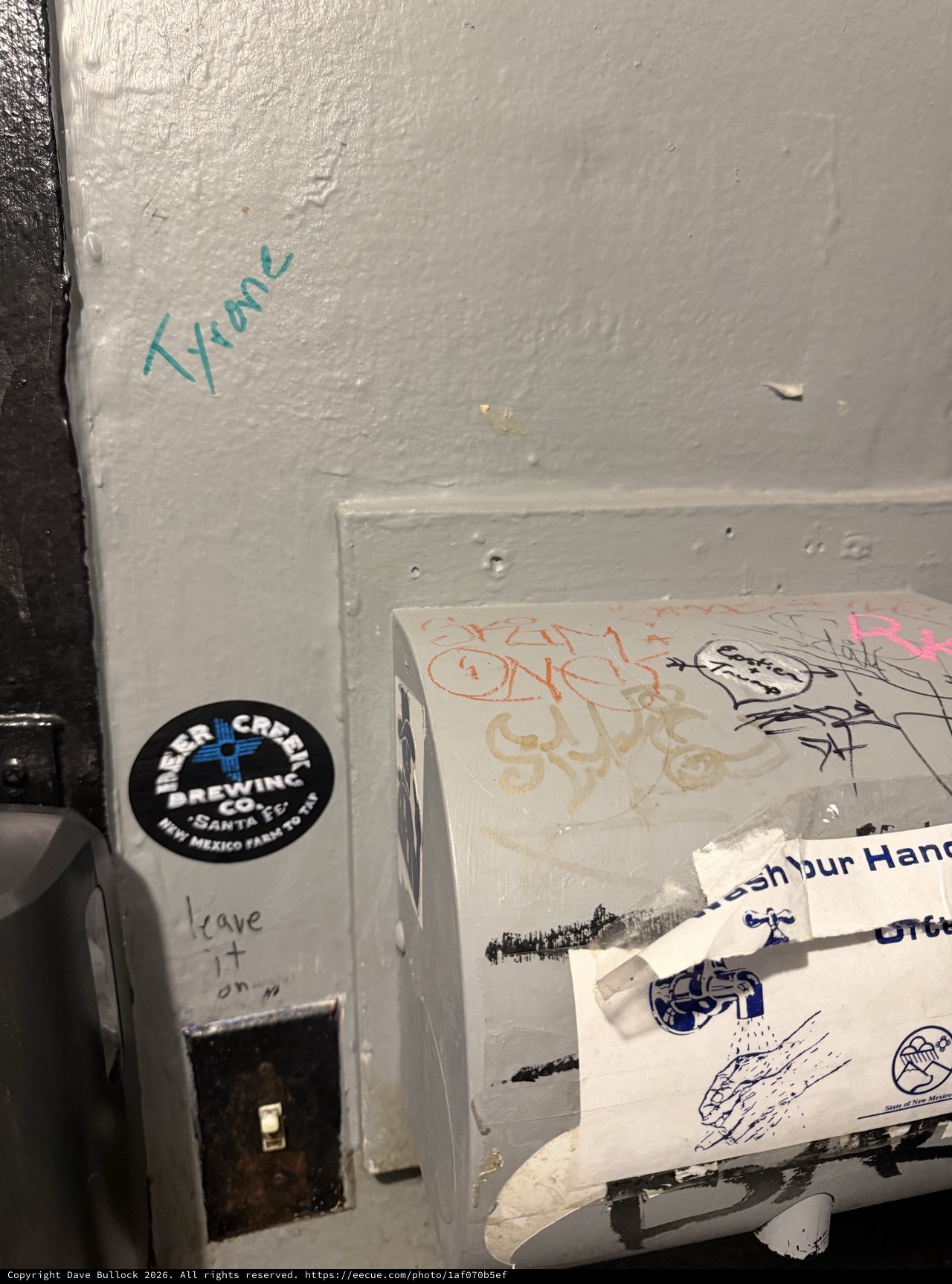 Graffiti and Stickers in Urban Bathroom Corner